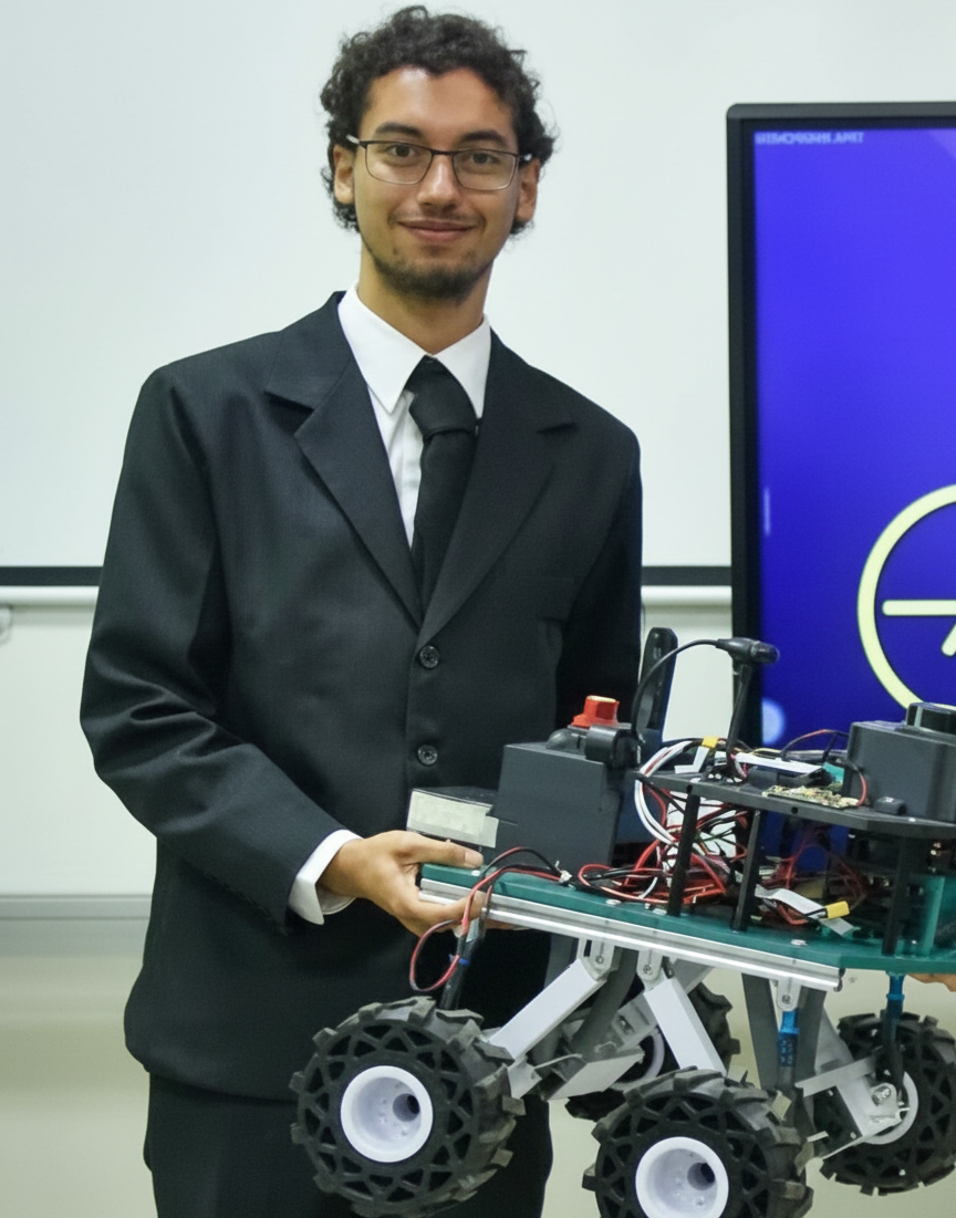 Joshua Cobos working on a robotics project